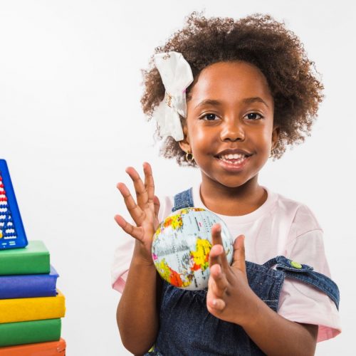 child-playing-with-globe-studio